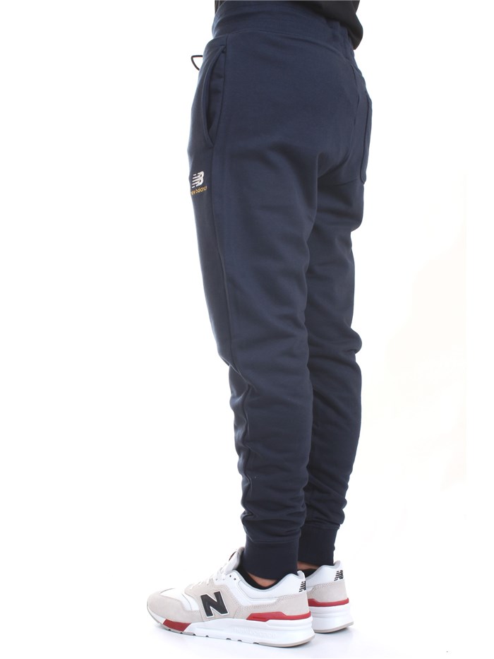 NEW BALANCE MP11590 Blue Clothing Man Trousers