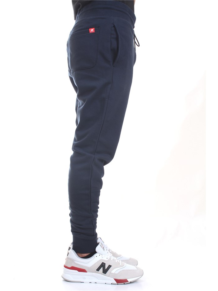 NEW BALANCE MP11590 Blue Clothing Man Trousers